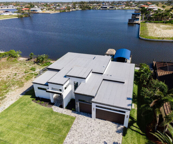 Top View Home Building Setup with Lake: Construction Services In Cape Coral, FL | Pascal Construction Inc.