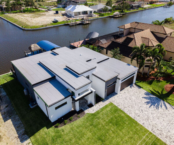 Top View Home Building Setup with Lake: Construction Services In Cape Coral, FL | Pascal Construction Inc.