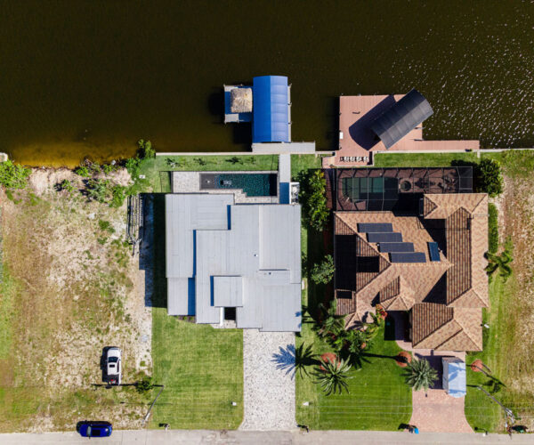 Top View Home Building Setup with Lake: Construction Services In Cape Coral, FL | Pascal Construction Inc.