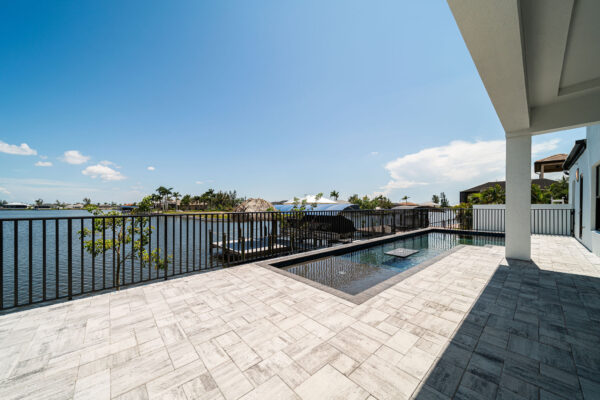 Home Model with Pool and lake: Construction Services In Cape Coral, FL | Pascal Construction Inc.
