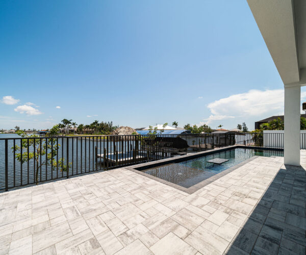 Home Model with Pool and lake: Construction Services In Cape Coral, FL | Pascal Construction Inc.