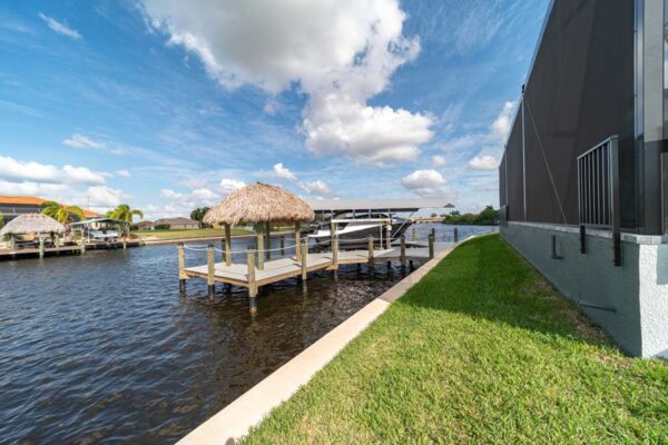 Outdoor Home Design with Lake Overview: Construction Services In Cape Coral, FL | Pascal Construction Inc.