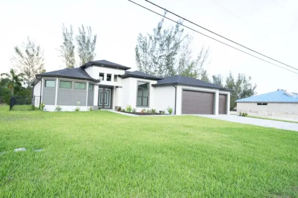 Outdoor Home Building Design with Lawn: Construction Services In Cape Coral, FL | Pascal Construction Inc.