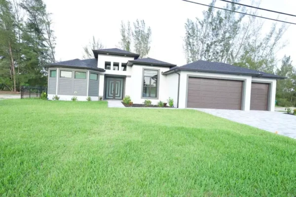 Outdoor Home Building Design with Lawn: Construction Services In Cape Coral, FL | Pascal Construction Inc.